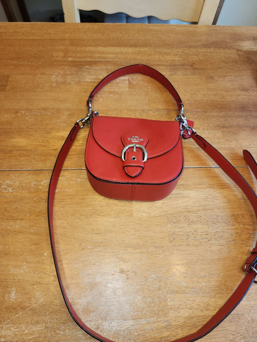 Coach Kleo Shoulder Bag 17 in refined pebble leather, featuring a bright red